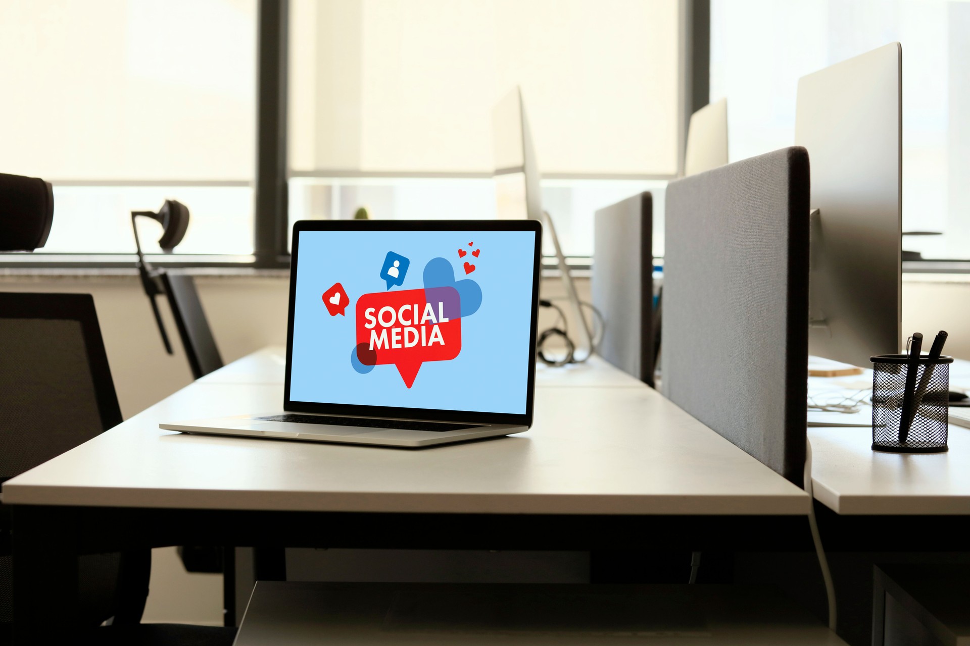 Laptop with social media screen on a desk