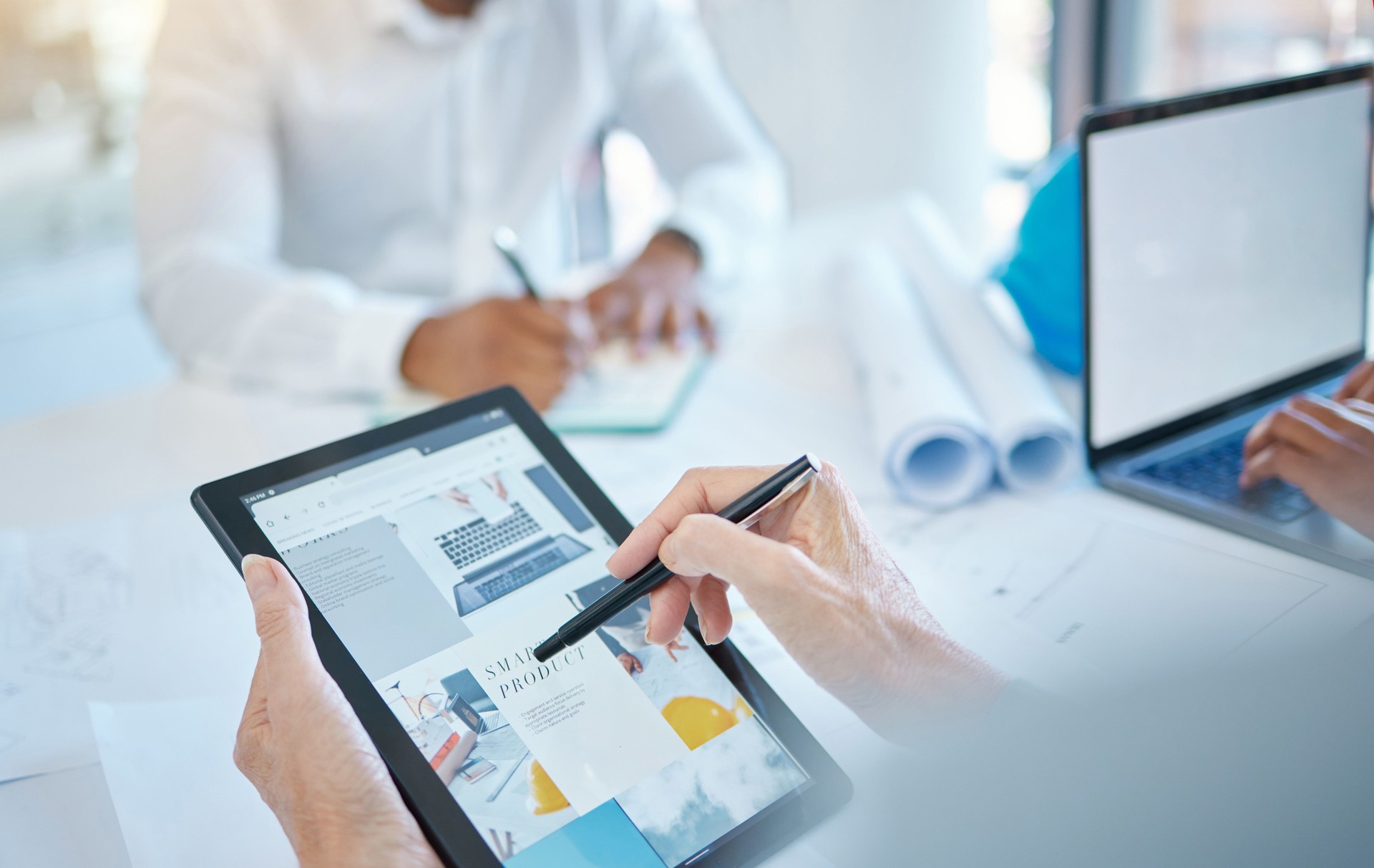 Graphic designer, digital marketing and tablet in business hands with website or web design for ux or ui product in a creative office or company. Advertising, SEO and tech screen software analytics
